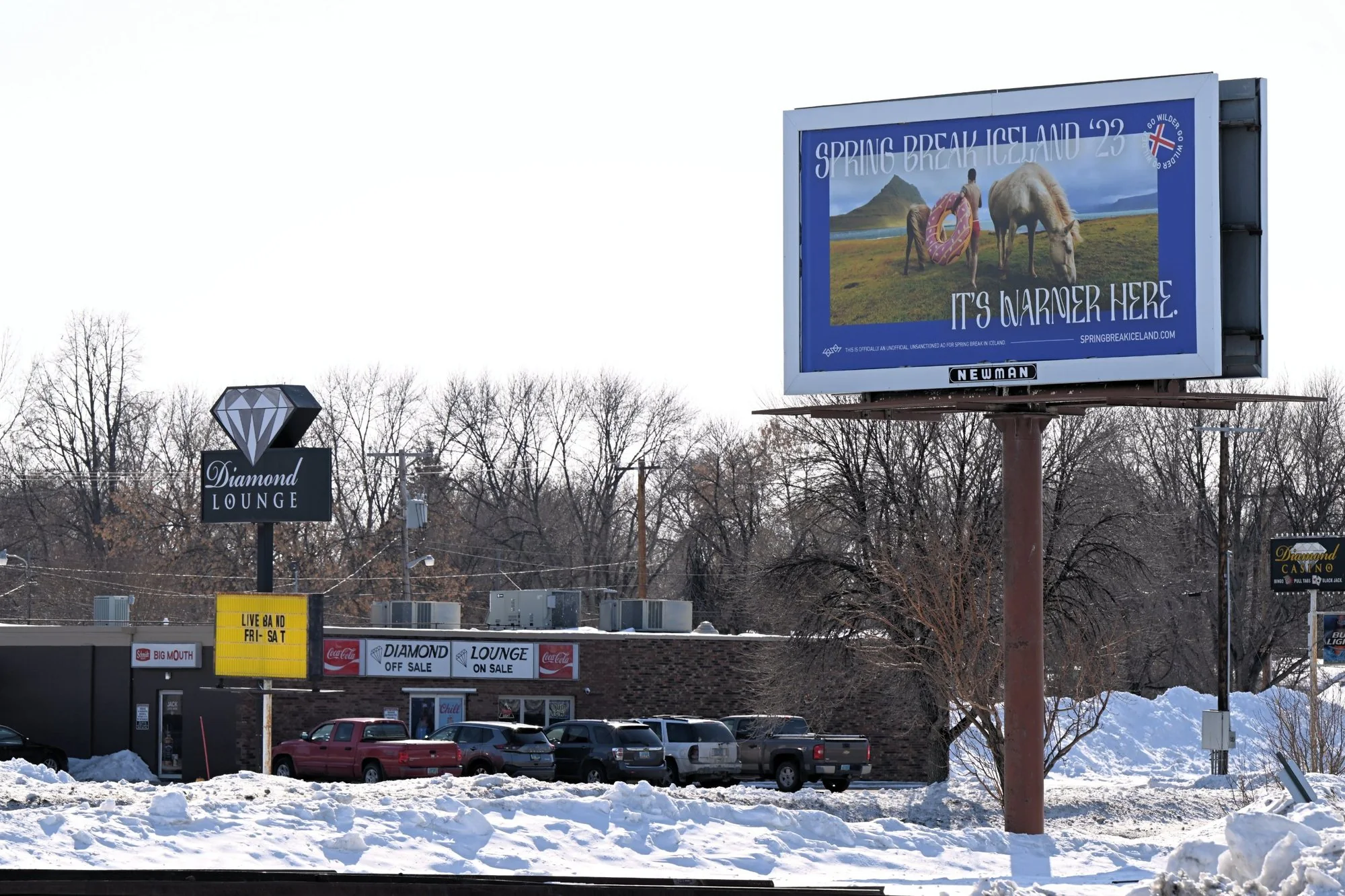 Spring Break Iceland billboard in snowy Grand Forks: It's warmer here.
